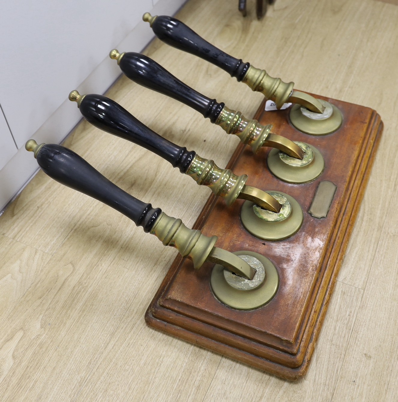 A brass and oak four tap counter beer dispenser - 64cm long